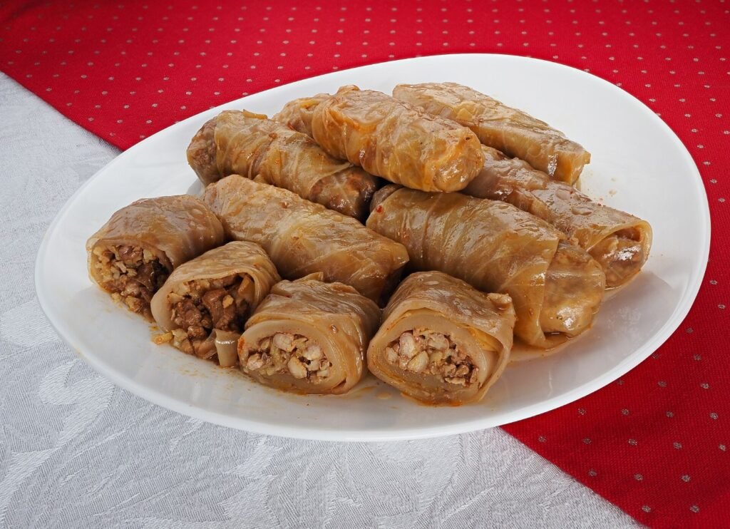 A plate of stuffed cabbage rolls filled with rice